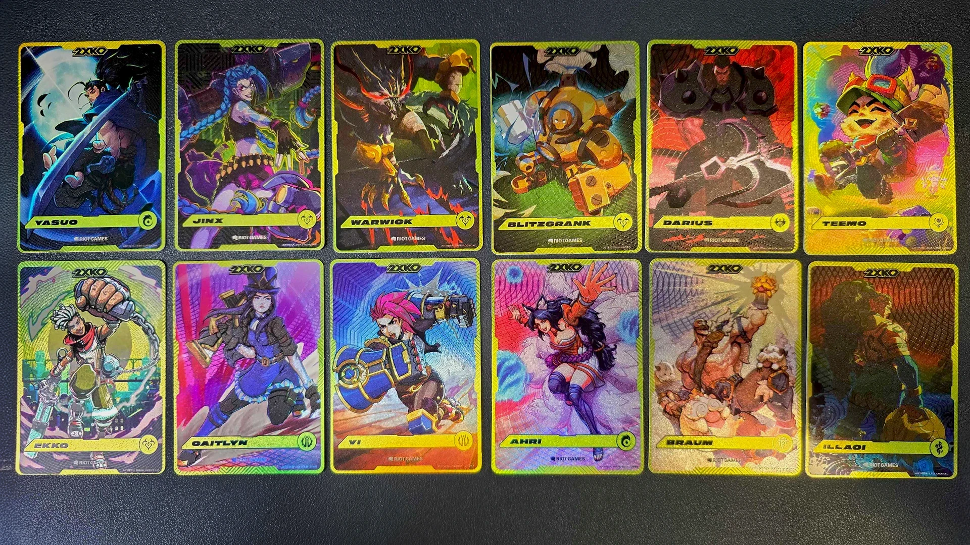 The full set of twelve printed 2XKO collectible promo cards handed out at the Riot Games booth at Gamescom Latam